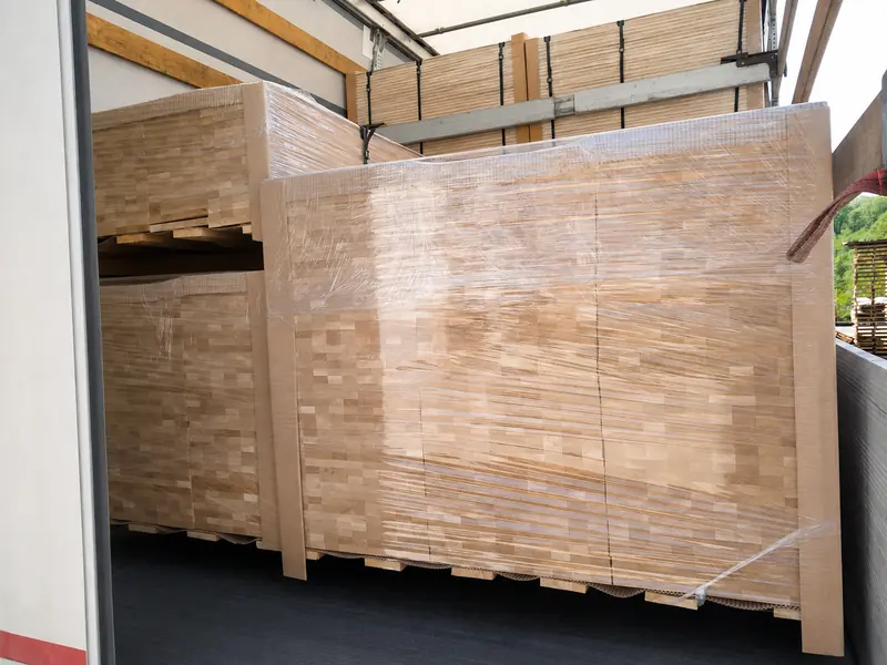 Three precision-machined beech mouldings shown in a clean product view