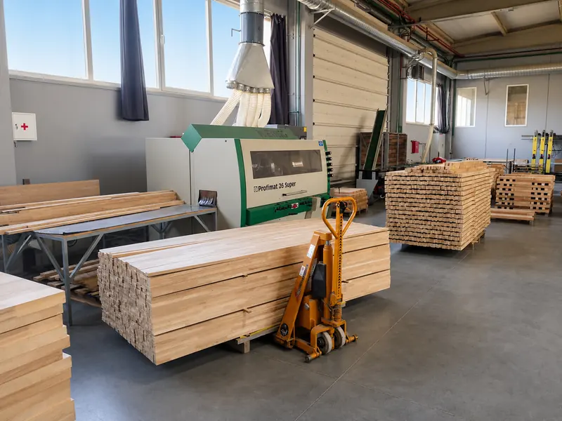 Profiling machine with prepared wood stock in a clean production area